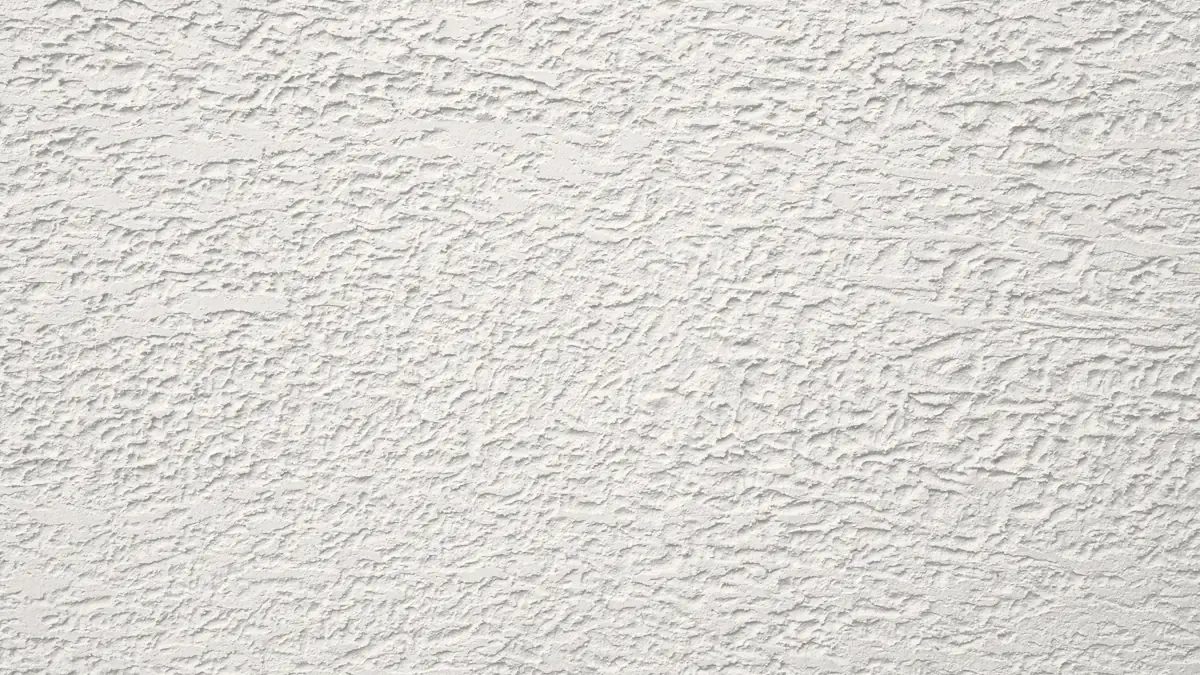 Close-up of heavy splatter drywall texture with raised peaks